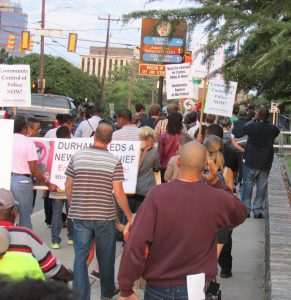 FADE coalition members march through downtown Durham on 9/16/13.