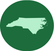 North Carolina silhouette on green circular background