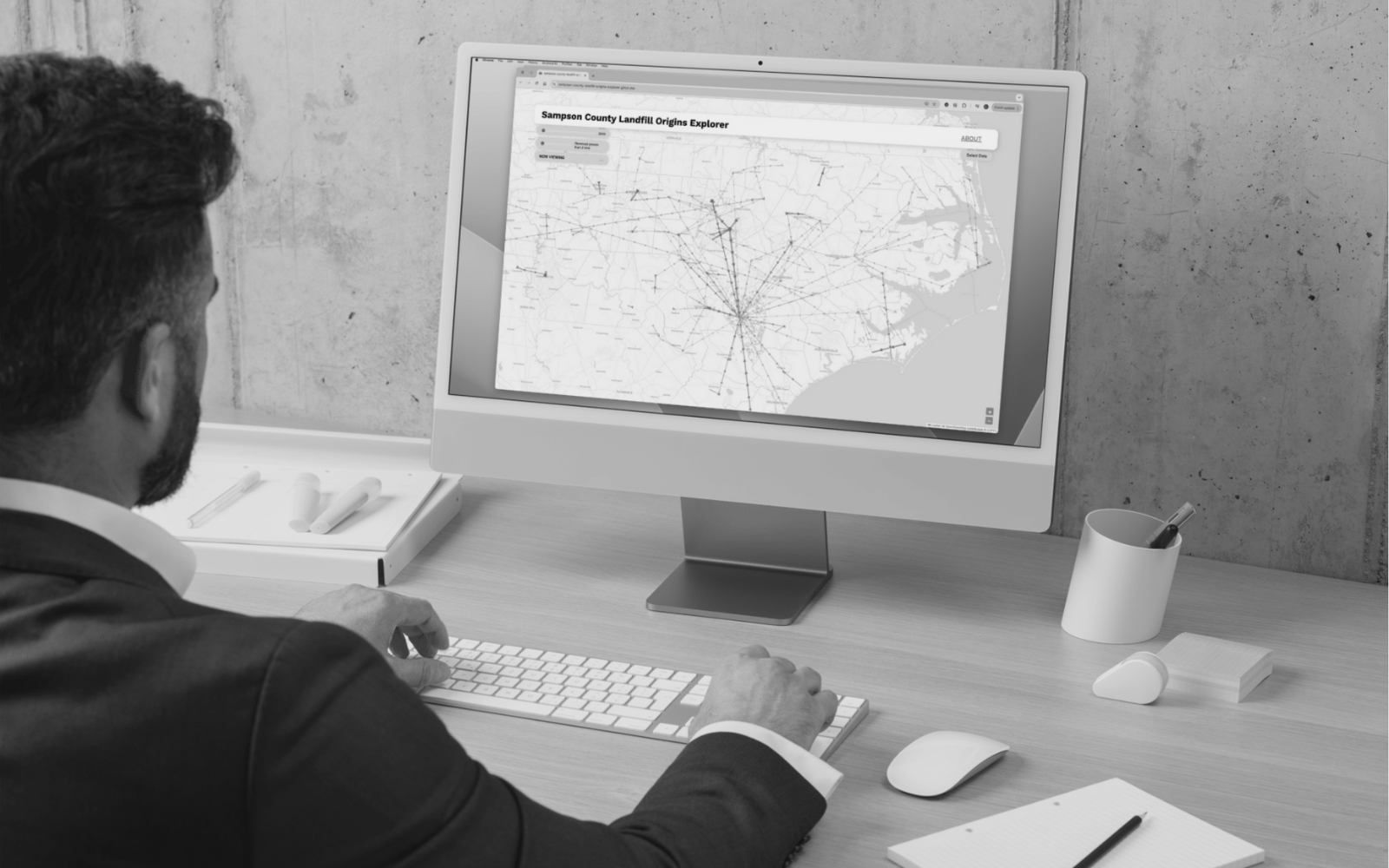 research (1) Researcher viewing the sampson county landfill origins map on desktop