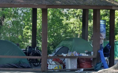 A tent sits near a fence at Oakwood Park on Tuesday, April 14, 2026, in Durham, N.C.