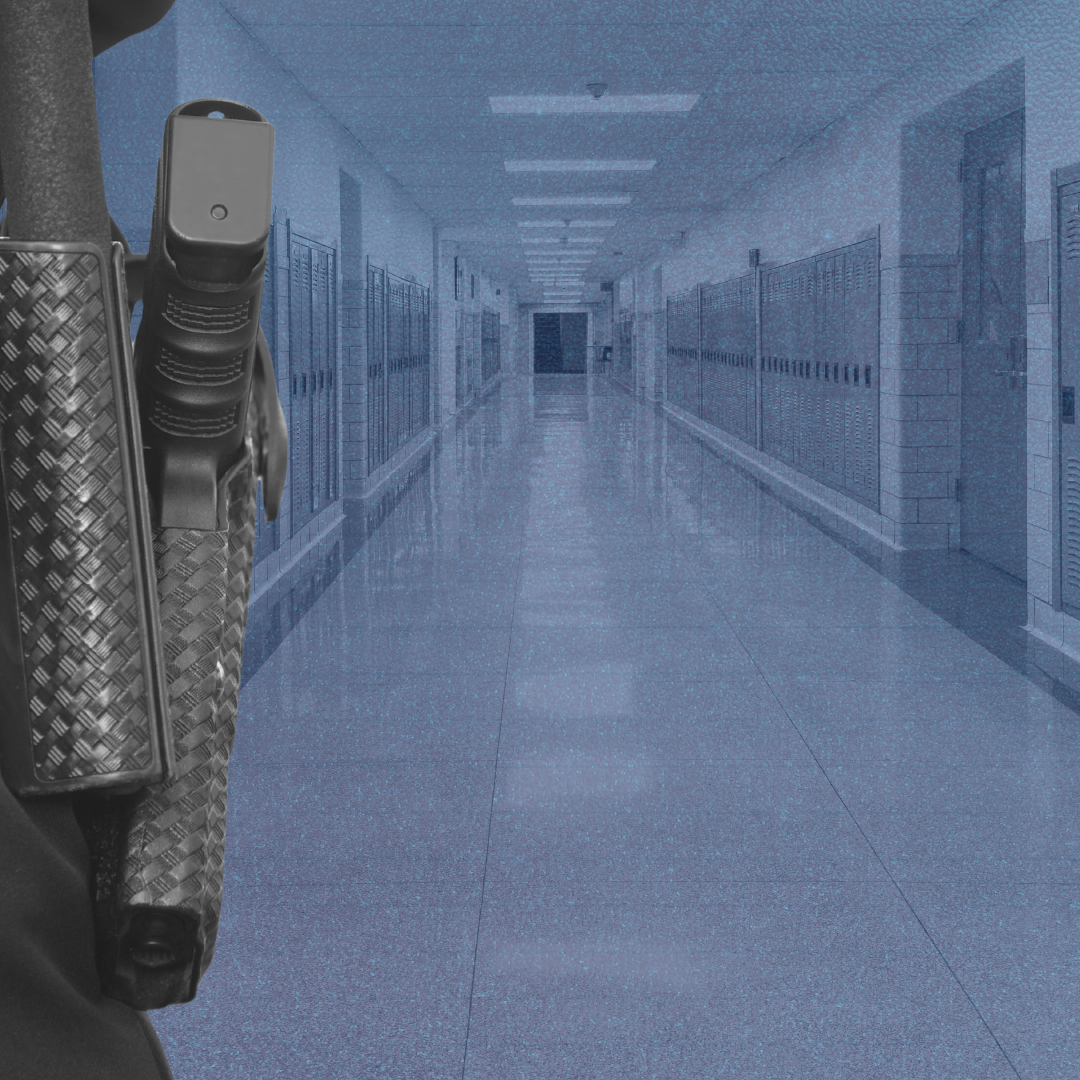 School Resource Officer standing in an empty school hallway